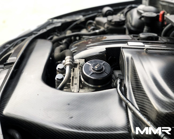 BMW N20, N52, N54, N55, S55 engine bay with MMX Performance billet oil filter housing, close-up view of engine bay trim.