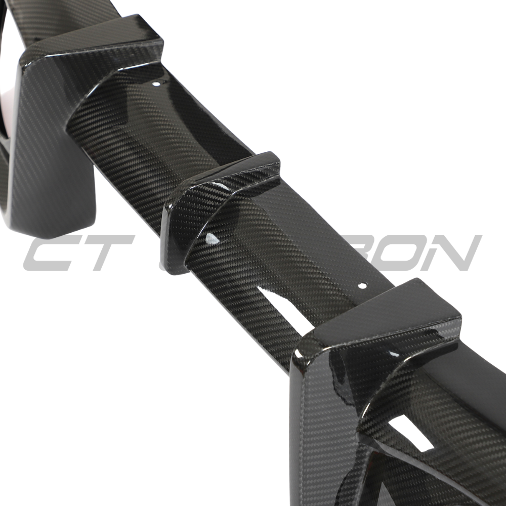 Porsche 911 992 Carrera carbon fibre diffuser by CT Design, showcasing sleek aerodynamic design and textured carbon fiber surface.