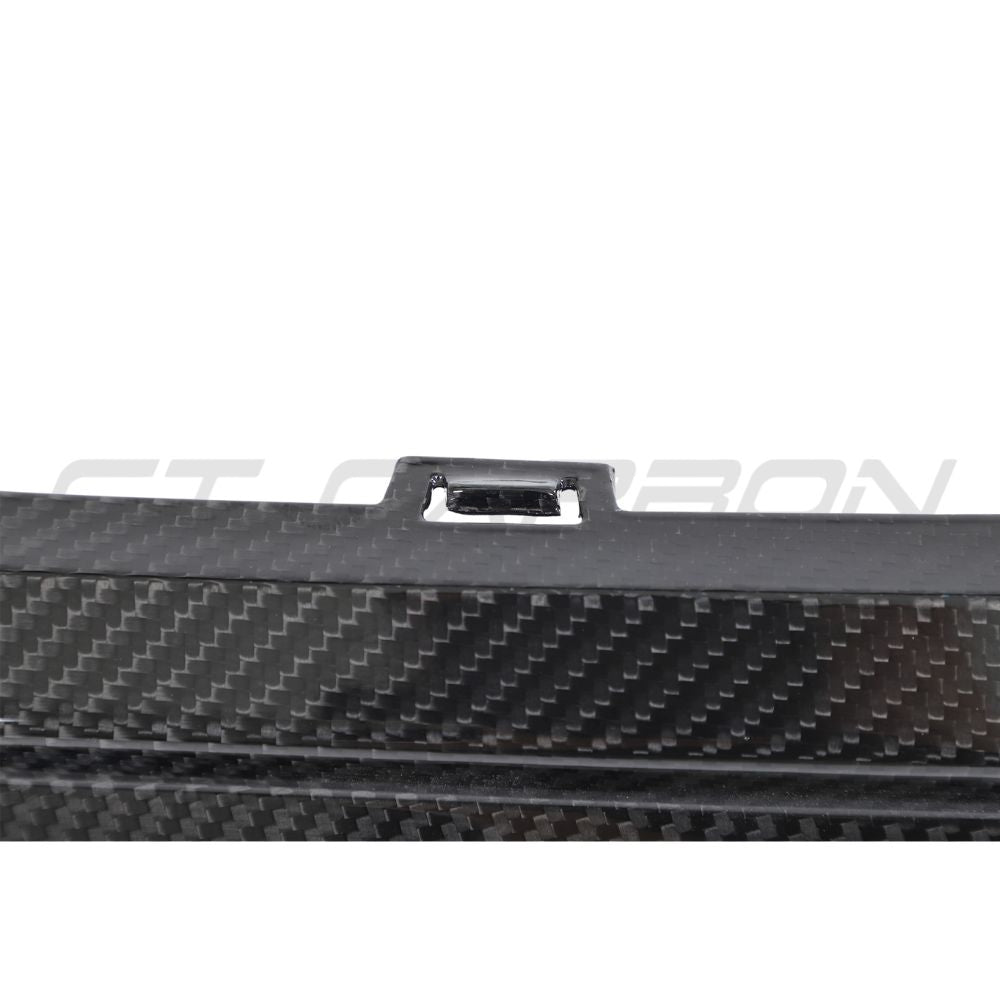 Porsche 911 992 Turbo S carbon fibre diffuser by CT Design, showcasing its sleek, aerodynamic design and textured carbon fibre surface.