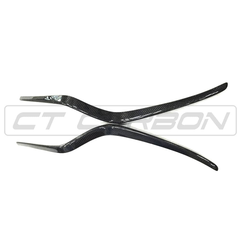 Carbon fiber front bumper trim for Porsche Macan 2014-2017 by CT Carbon, showing close-up of sleek, textured accessory detail.