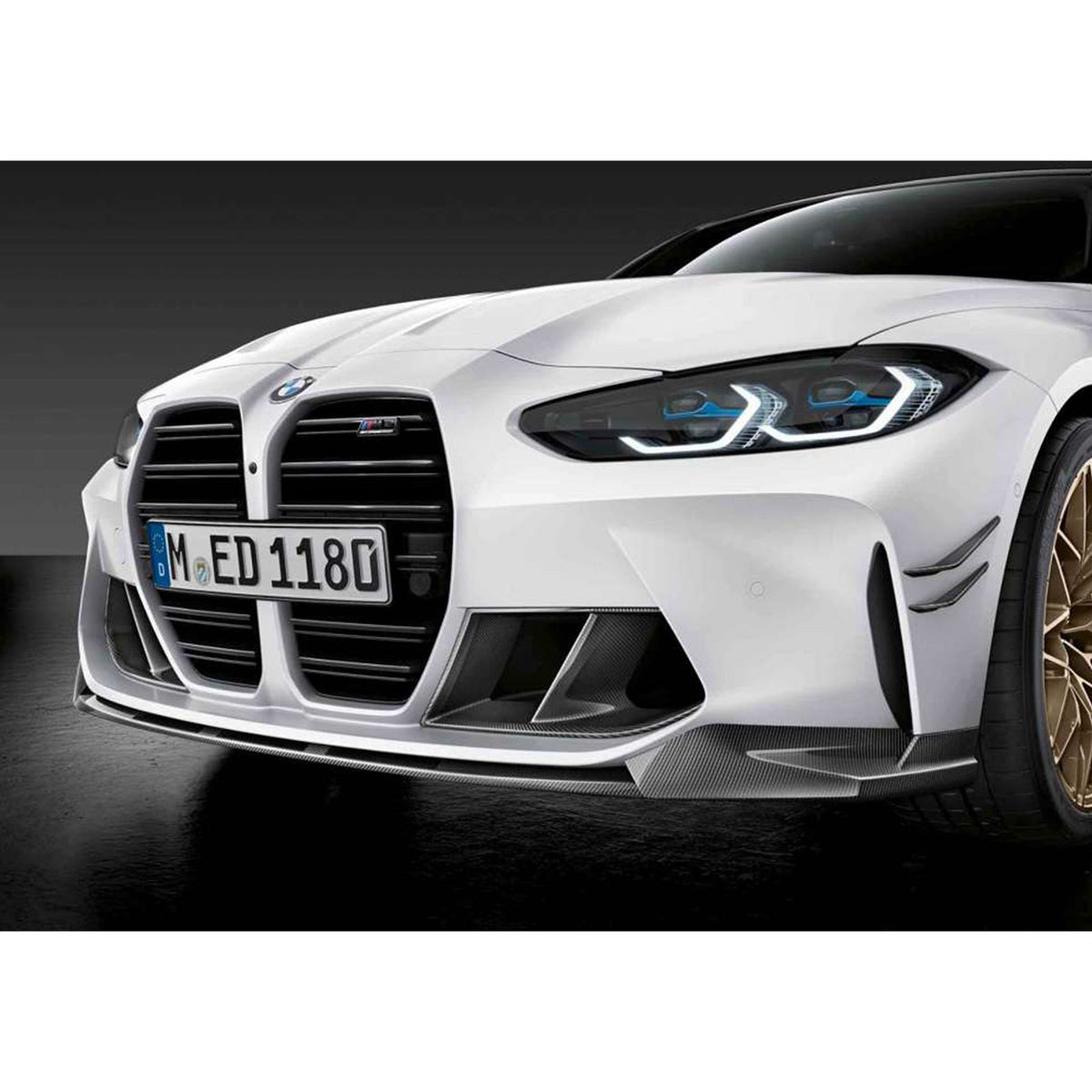 Genuine BMW M Performance front splitter in carbon fiber for G80 G81 G82 M3, enhancing aerodynamics and sporty appearance.