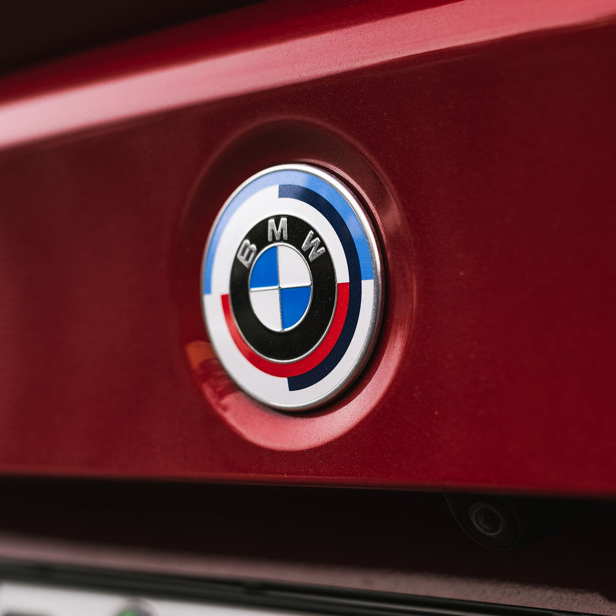 Genuine BMW 50 Years of M badge emblem for front and rear, designed for X5 G05, showcasing the commemorative badge.