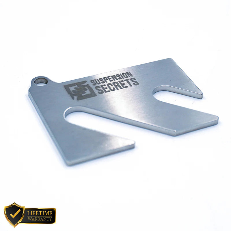 Suspension Secrets camber shim kit for Porsche 911 (997) GT3/RS and GT2/RS, showing metal shims and suspension linkages.