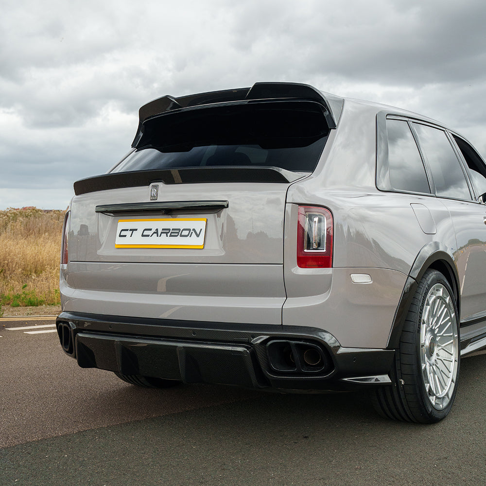 Rolls Royce Cullinan carbon fibre middle spoiler by CT Carbon, close-up view showing sleek design and textured finish.