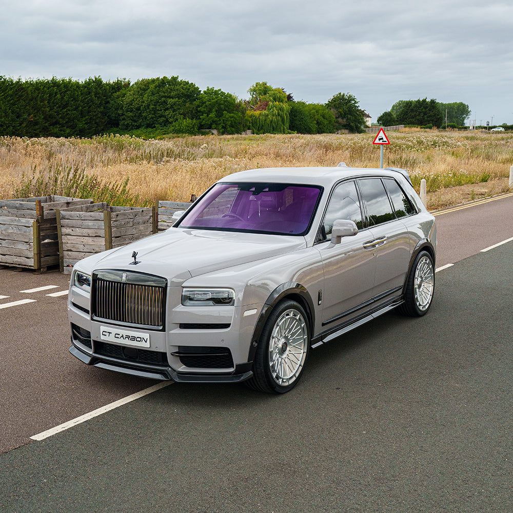 Rolls Royce Cullinan carbon fibre roof spoiler by CT Carbon, showing sleek aerodynamic design and glossy finish on the vehicle.
