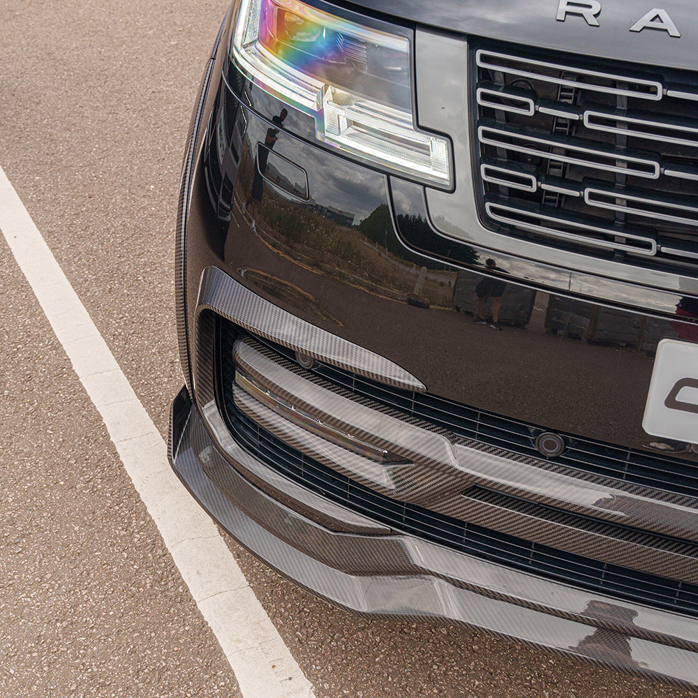 Range Rover L460 2022+ Carbon Fibre Front Bumper Trim by CT Design, close-up of sleek, textured automotive accessory.