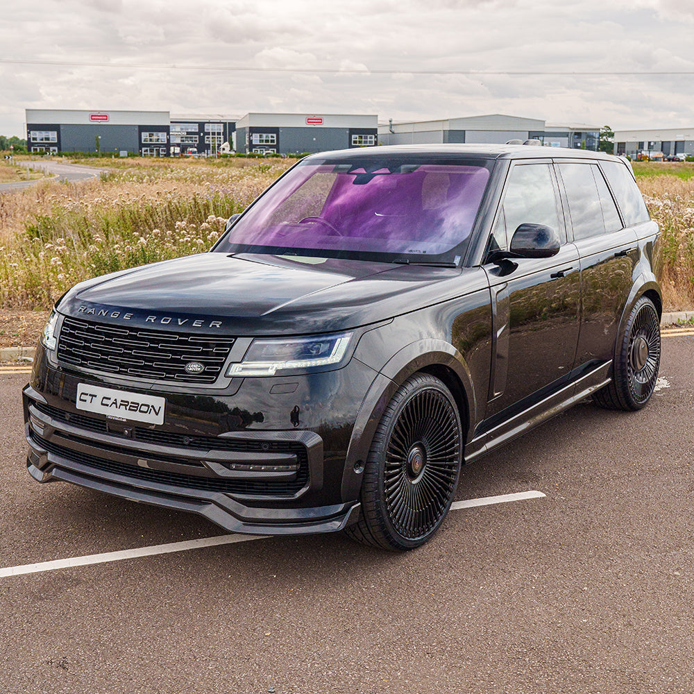 Range Rover L460 2022+ carbon fibre side door trim accessory by CT Carbon, close-up view of sleek, textured door detailing.
