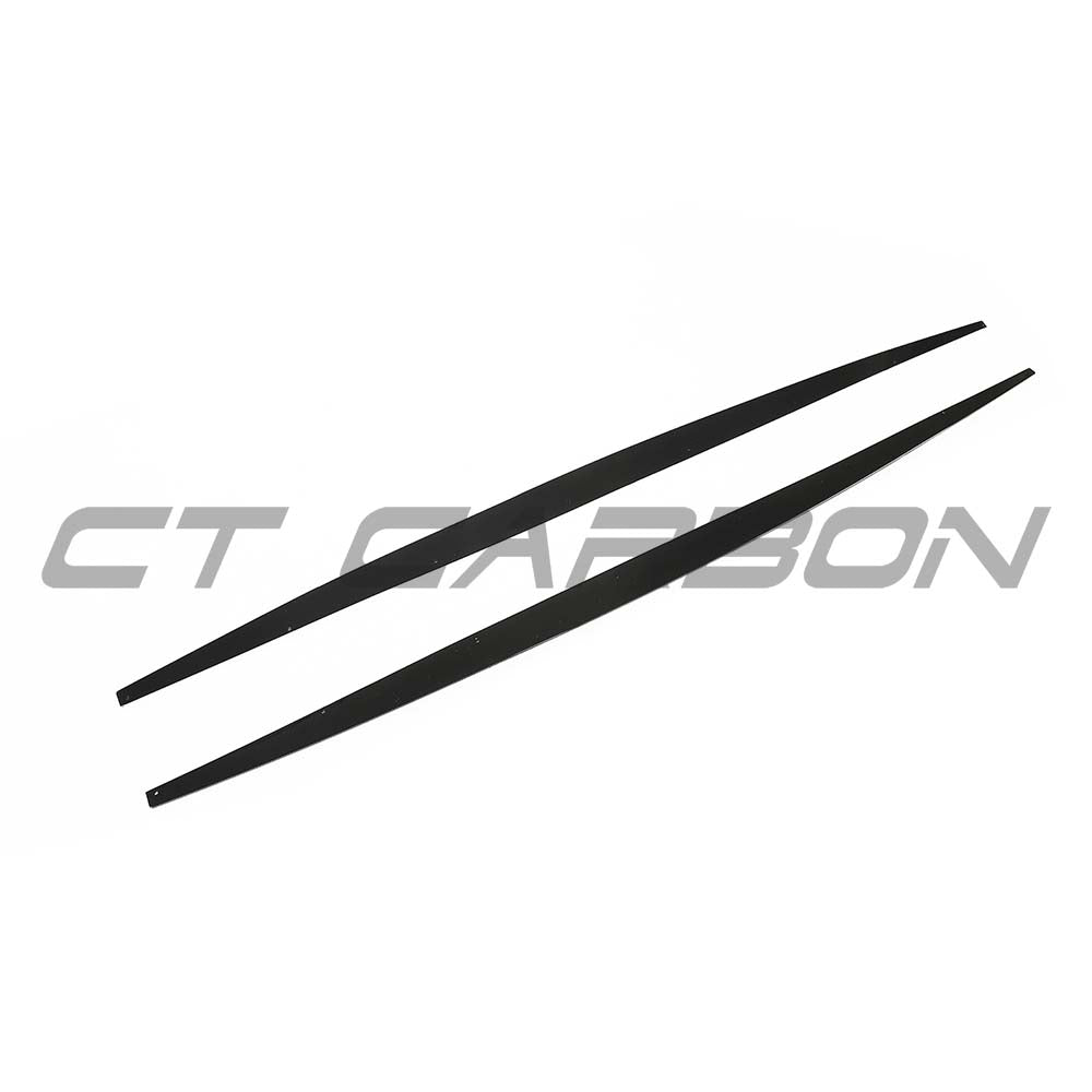 BMW F20/F21 1 Series LCI dual exit gloss black side skirts kit by CT Carbon, shown from the side angle.