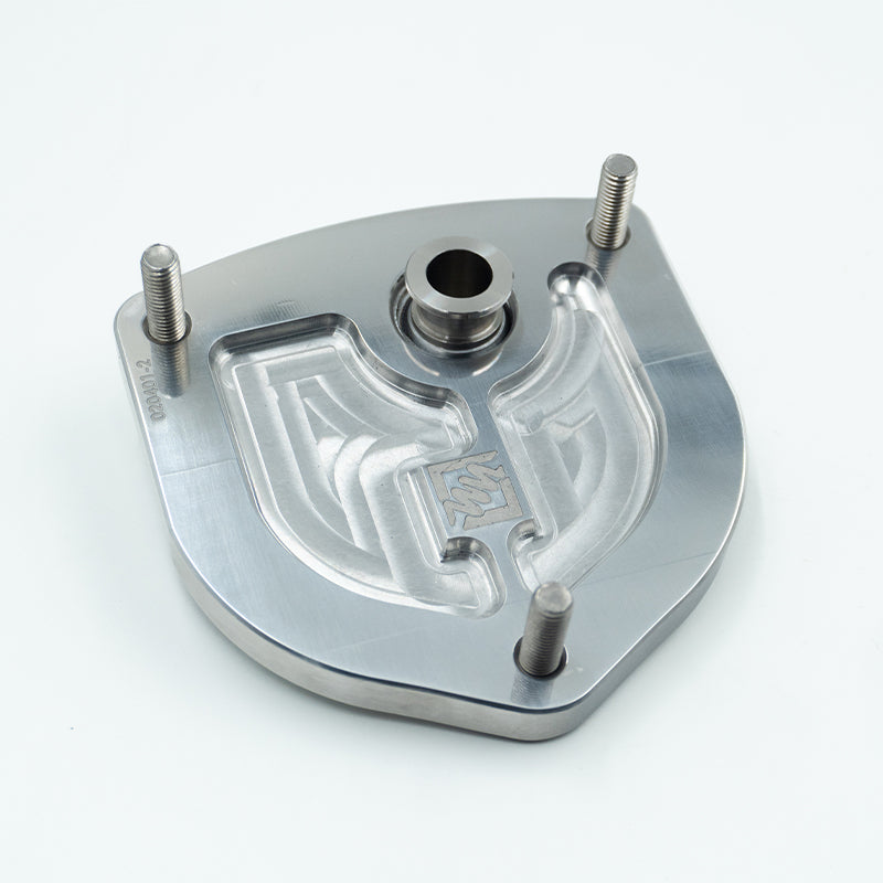 Suspension Secrets camber caster plate top mounts for Porsche 981 and 718 Cayman GT4, close-up of suspension linkage components.