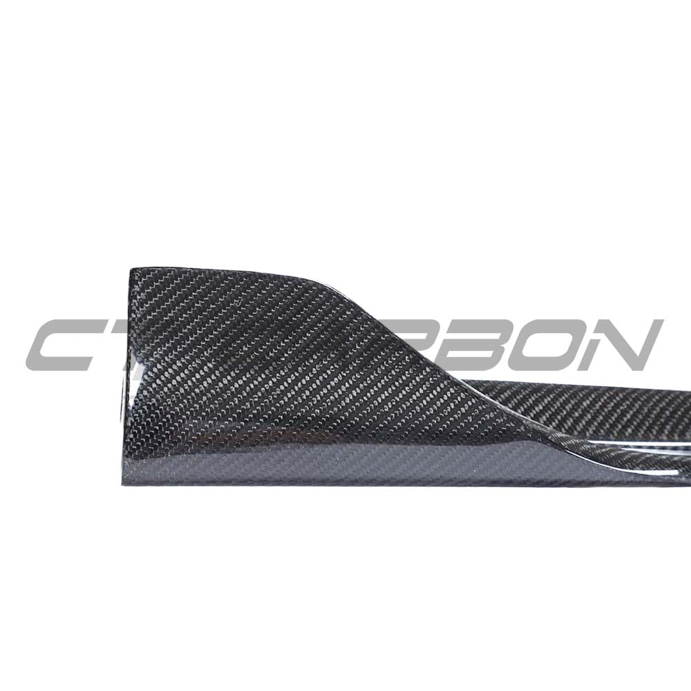 Tesla Model 3 2017-2023 CT Carbon carbon fiber side skirts installed on the car, highlighting sleek aerodynamic design.