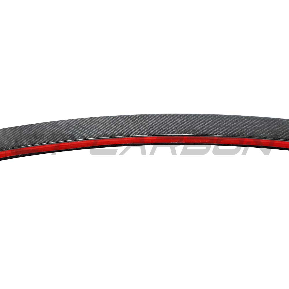 Tesla Model 3 carbon fiber spoiler V2 by CT Carbon, showing sleek black aerodynamic design on the car's rear.