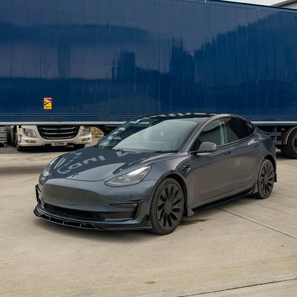 Full gloss black car kit for Tesla Model 3 by CT Carbon, showcasing sleek black exterior accessories for the vehicle.