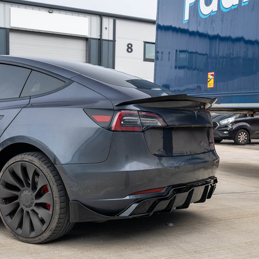 Tesla Model 3 full gloss black car kit by CT Carbon, featuring sleek black exterior accents and trim for a stylish finish.