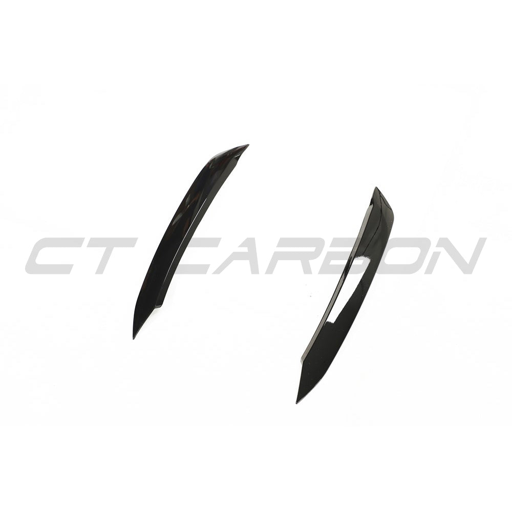 Gloss black Volkswagen Polo MK6 headlight eyebrows accessory by CT Carbon, shown installed on the vehicle's front headlights.