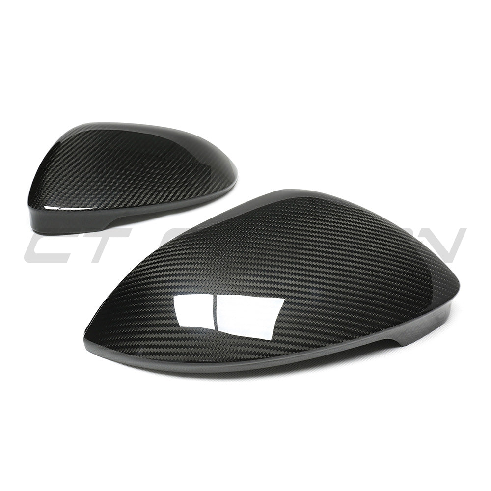 VW GOLF MK8 carbon fibre side mirrors by CT Carbon, showing sleek black finish, without lane assist, mounted on vehicle.