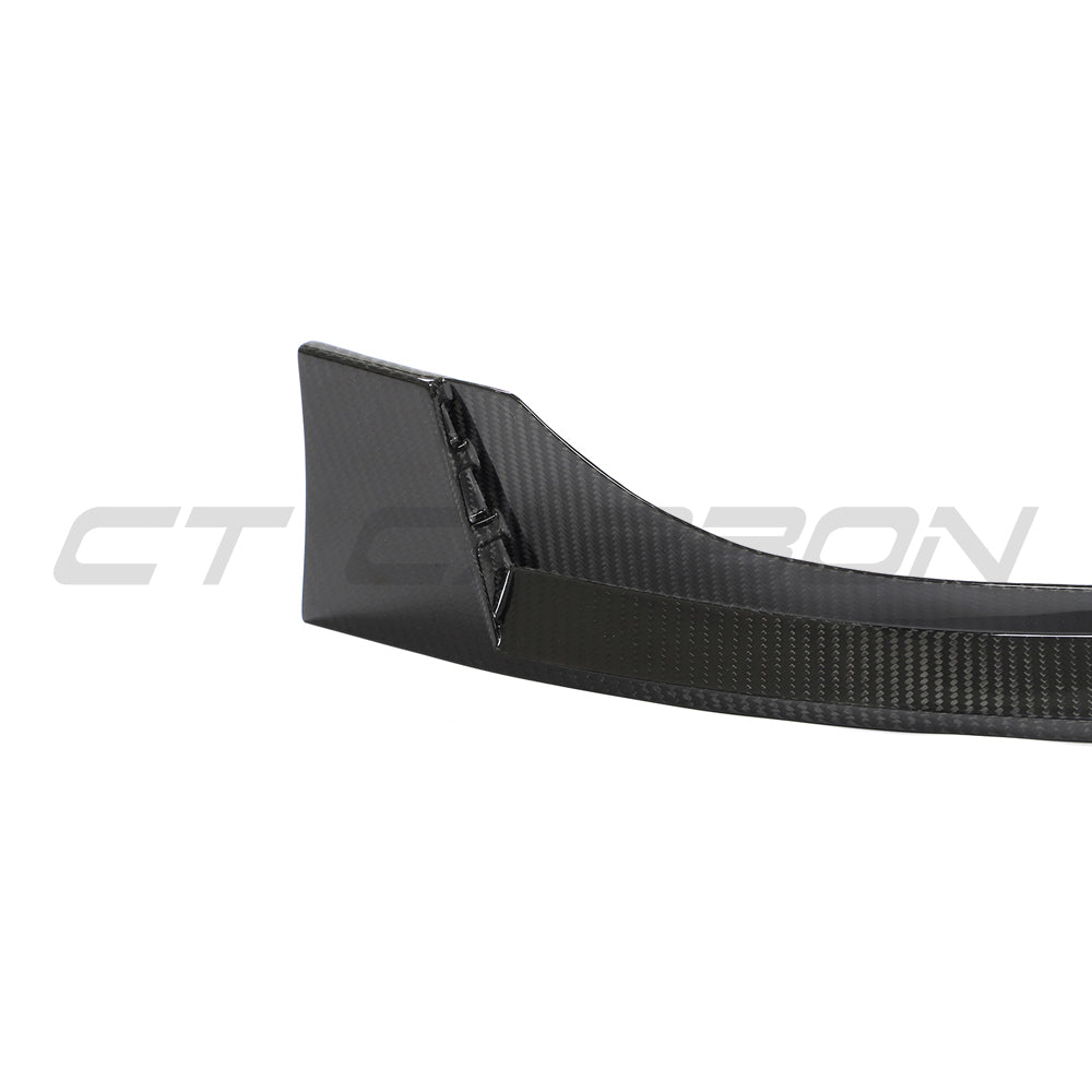 Carbon fiber front splitter for VW Golf MK8 GTI by CT Carbon, showcasing the sleek V2 design on the vehicle's front bumper.