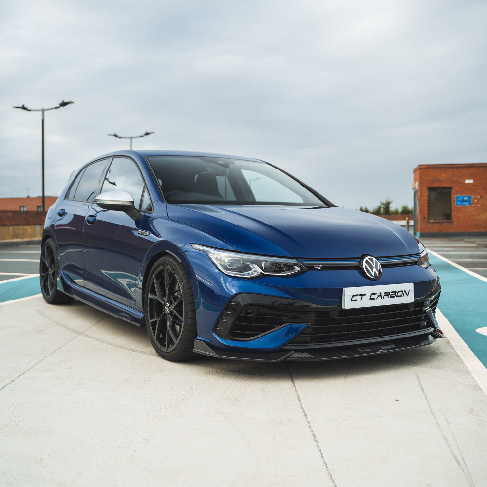 VW Golf MK8 and MK8.5 R carbon fibre side skirts by CT Carbon, showing sleek, aerodynamic design on the vehicle's side.