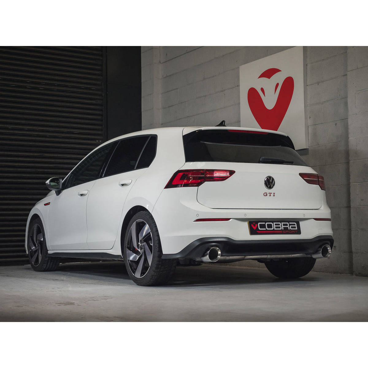 Cobra Sport VW Golf Mk8 GTI 2.0 TSI GPF/OPF back performance exhaust installed in workshop setting.