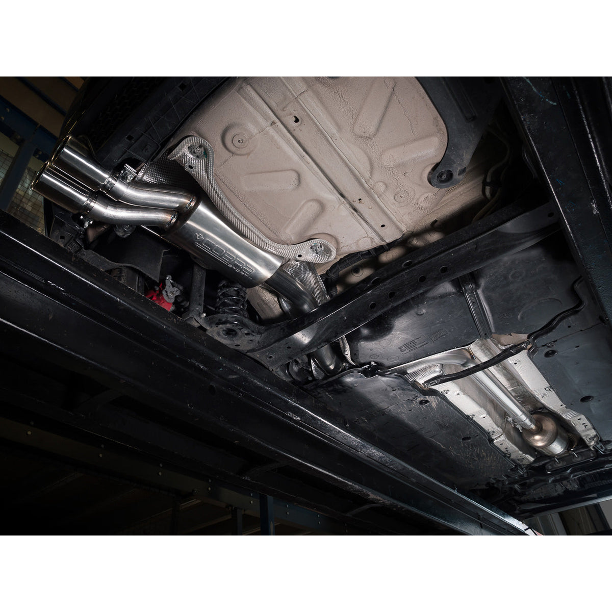 Cobra Sport VW Polo GTI AW Mk6 2.0 TSI GPF back performance exhaust installed on a blue VW Polo GTI, highlighting the exhaust system.