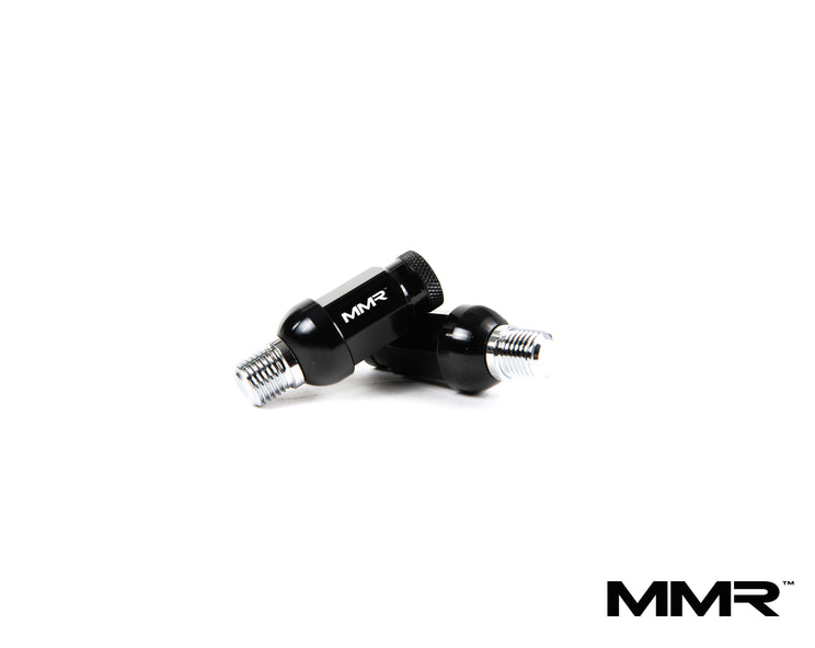 MMX Performance wheel stud and nut conversion kit for BMW and Mini, showing installed studs and nuts on a vehicle wheel.