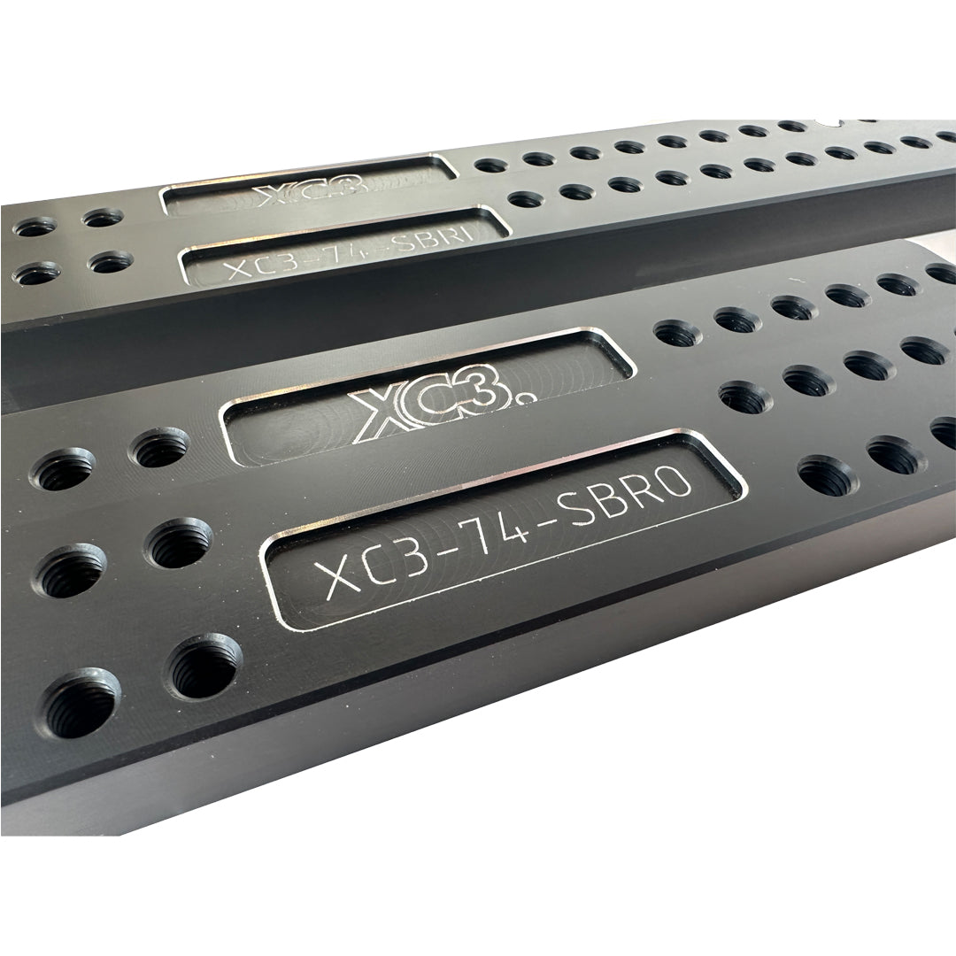 Universal BMW M2 M3 M4 G8X bucket seat base floor mount adapter bracket kit by XC3 Engineering, shown on vehicle floor.