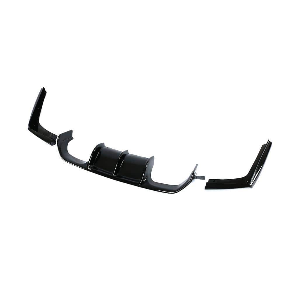 BMW M3 M4 G80 G82 F80 F83 V Style gloss black diffuser by CT Carbon, showcasing the aerodynamic rear automotive accessory.