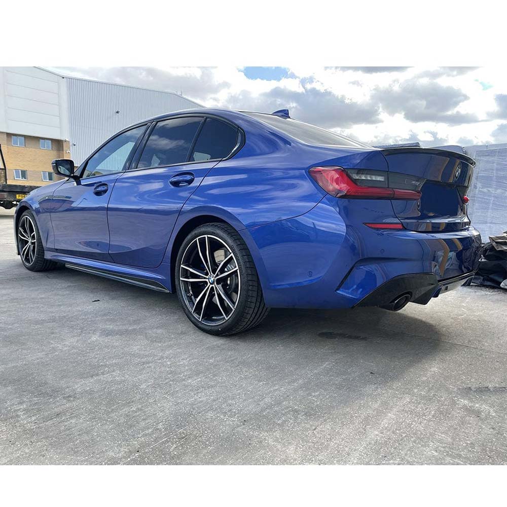 BMW 3 Series G20 gloss black full exhaust kit by CT Carbon with round tips, designed for a sleek, sporty look.