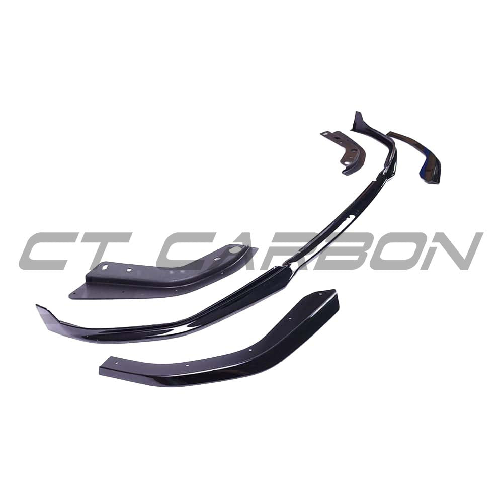 BMW 3 Series G20 gloss black full kit with round exhaust exits by CT Carbon, showcasing the sleek carbon fiber design.