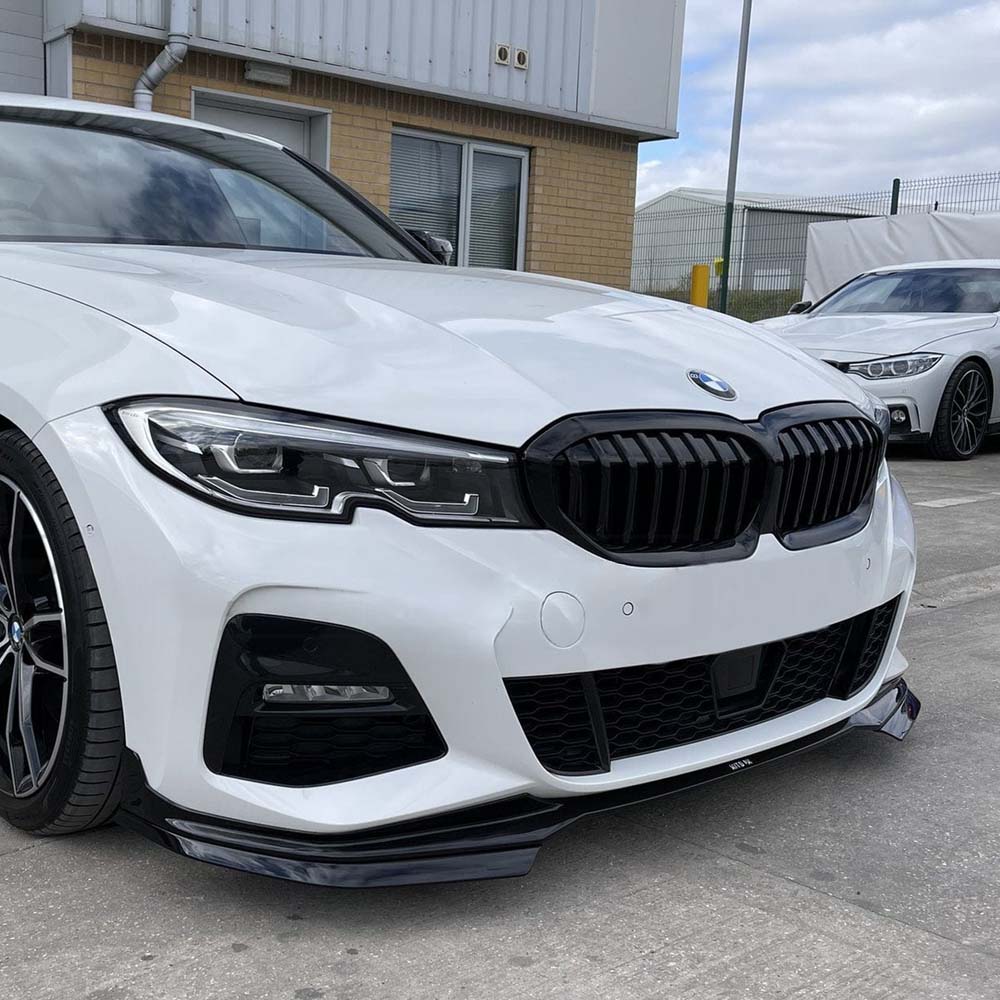 BMW 3 Series G20 gloss black full exhaust kit by CT Carbon with round exhaust tips, showcasing sleek, high-quality carbon fiber design.