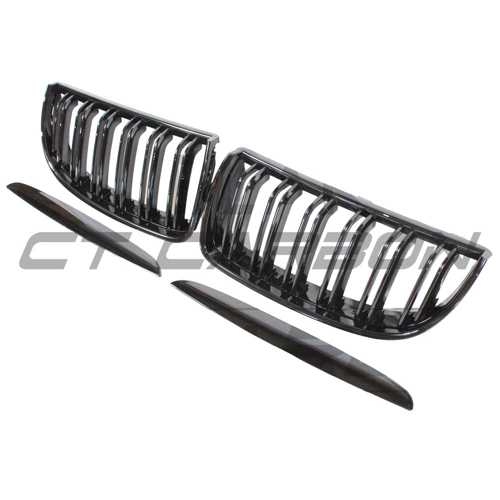 BMW E90 3 Series Pre-LCI black double slat grille by CT Carbon, close-up view showing sleek black finish and grille design.