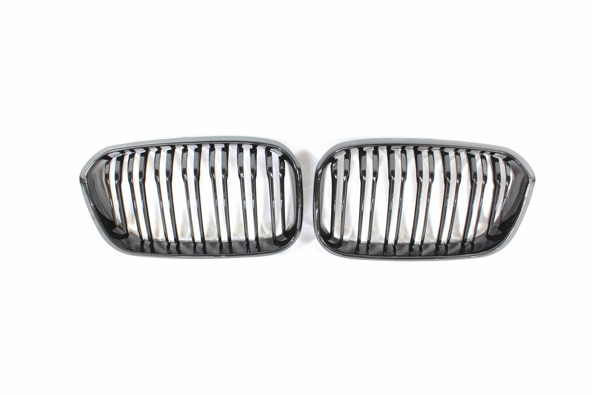BMW F20 1 Series LCI double slat gloss black grille by CT Carbon, showcasing sleek black finish and grille design.