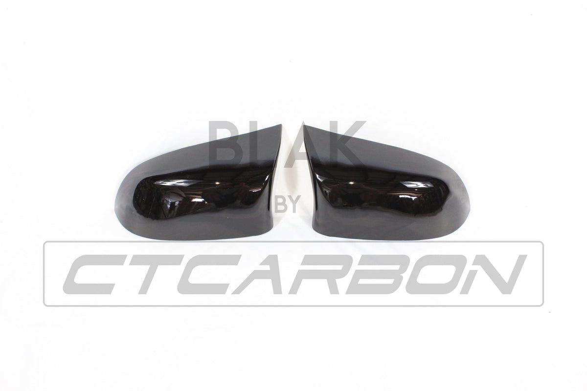 Gloss black mirror replacements for BMW F15/F16 X5/X6 from CT Carbon, showcasing sleek, high-quality exterior accessories.