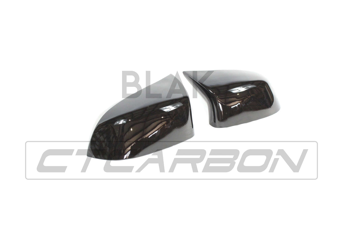 Gloss black mirror replacements for BMW F15/F16 X5/X6 2014-2018 by CT Carbon, showing sleek side mirror covers.
