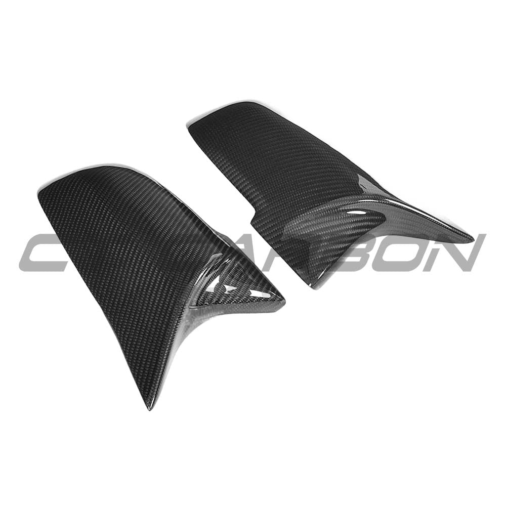 Black carbon fibre mirror covers for BMW F40/F44 1 and 2 Series by CT Carbon, showing sleek, glossy finish on the mirror caps.
