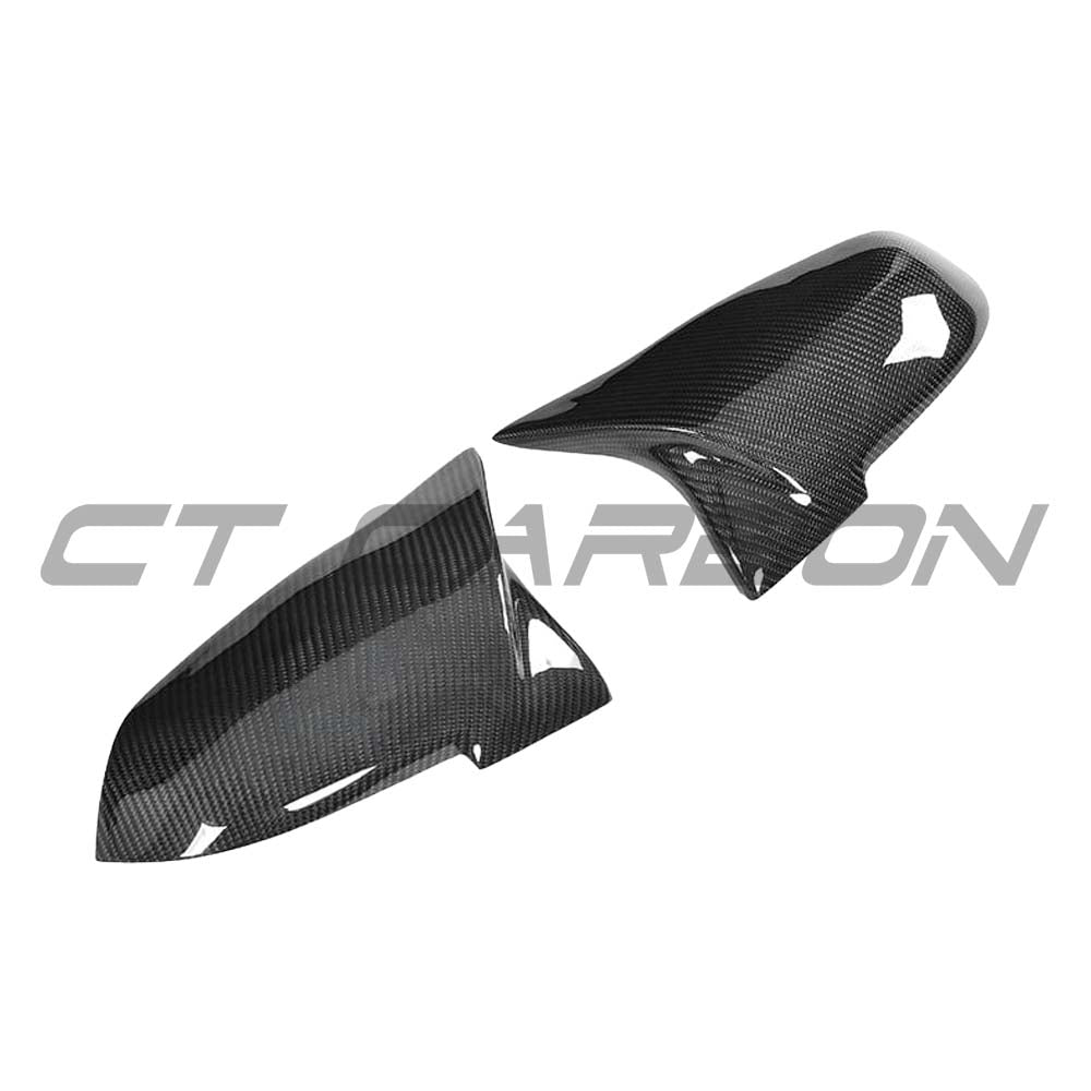 BMW F40 F44 1 & 2 Series carbon fiber mirror covers by CT Carbon, showcasing sleek black replacement accessory for side mirrors.