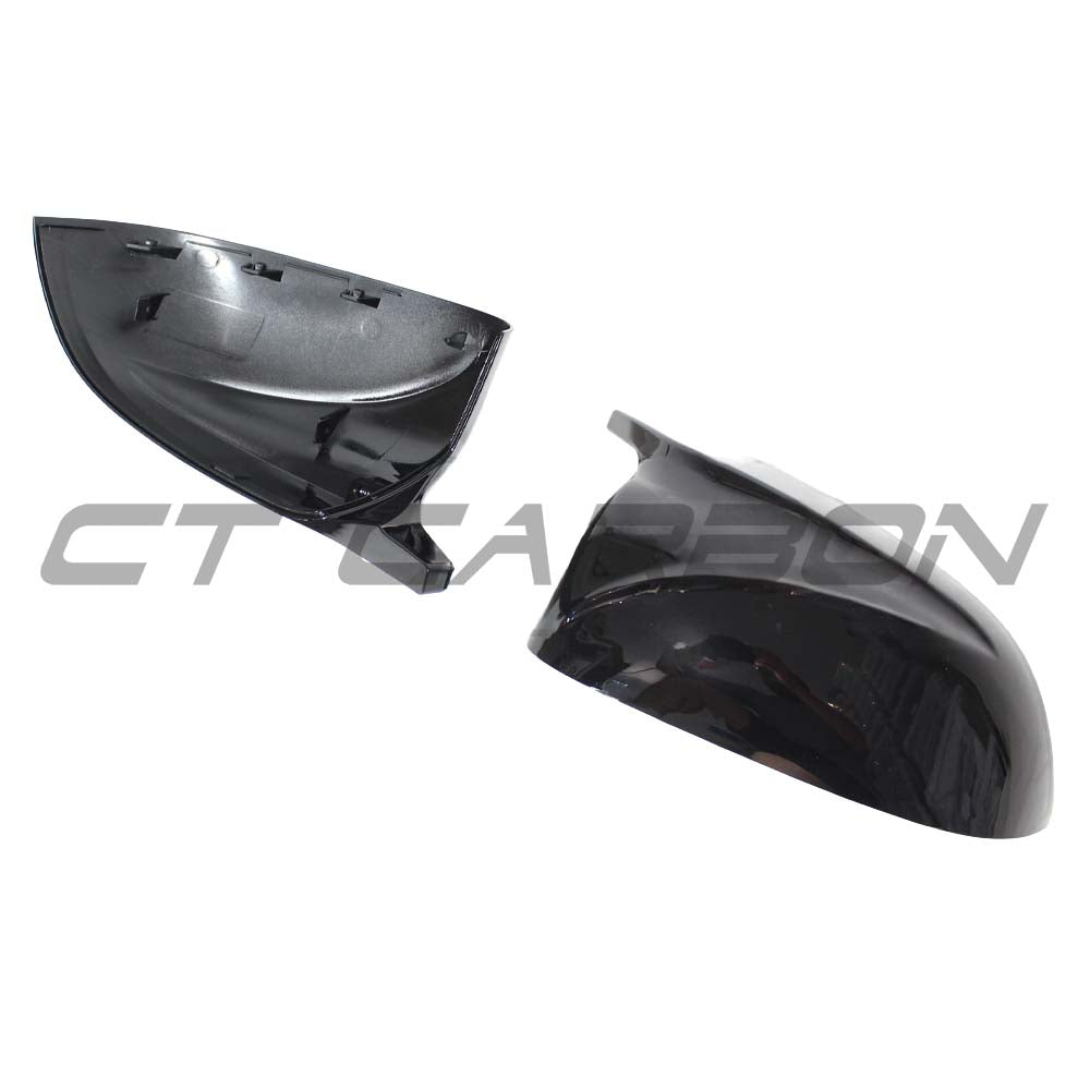 Gloss black BMW X3/X4/X5/X6 G01/G02/G05/G06 mirrors by CT Carbon, showcasing sleek, aerodynamic side mirror covers.