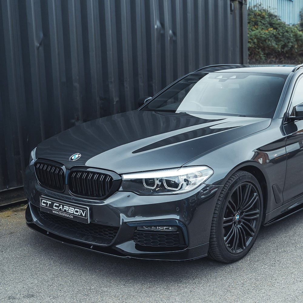 BMW 5 Series G30/31 pre-LCI gloss black splitter by CT Carbon, front view showcasing sleek aerodynamic design.
