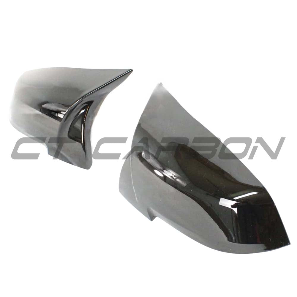 BMW Fxx Series mirrors by CT Carbon in gloss black, showing sleek, aerodynamic replacement mirror housings for 1, 2, 3, and 4 Series.