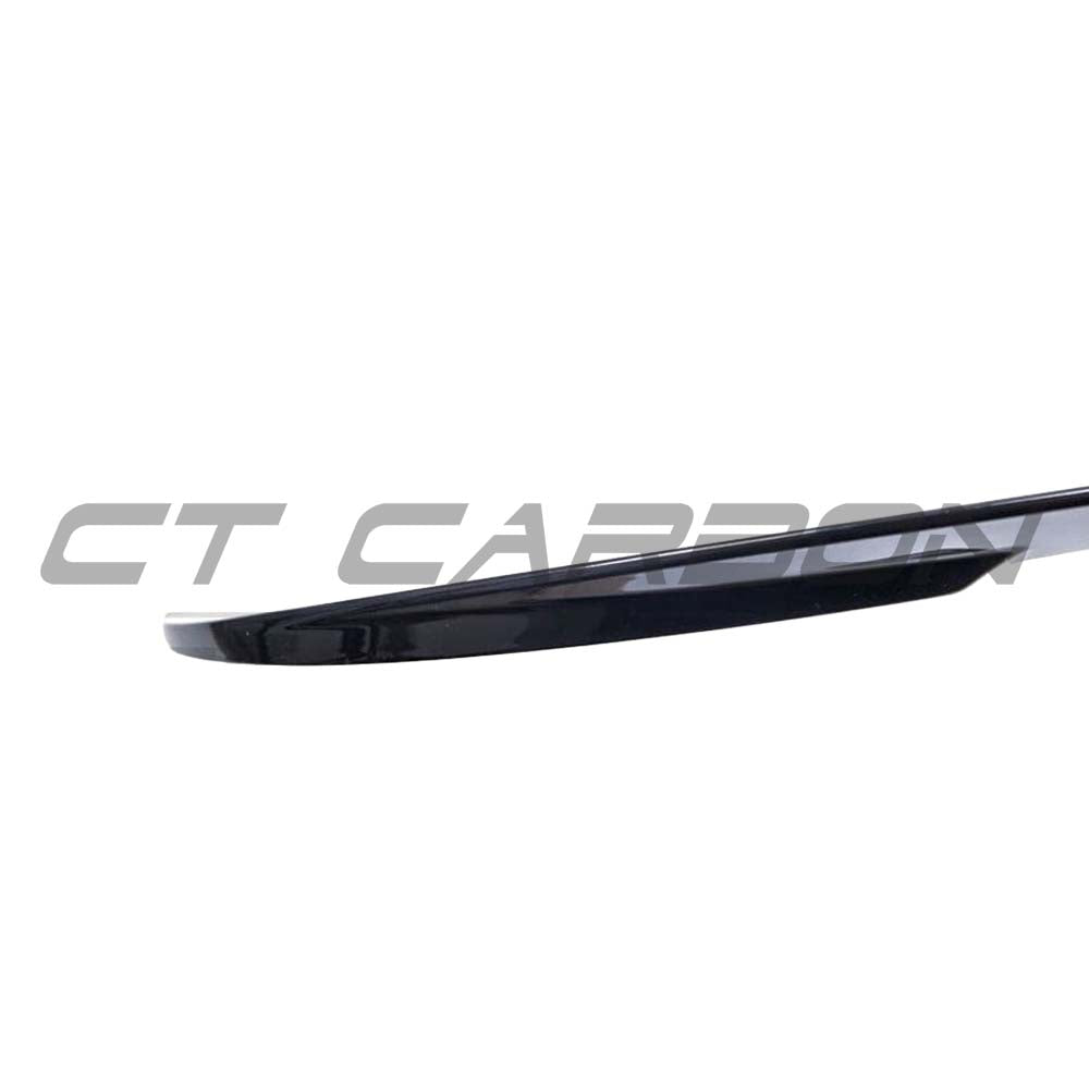 Gloss black BMW 2 Series F23 spoiler by CT Carbon, V2 style, showcasing sleek aerodynamic design on a coupe model.