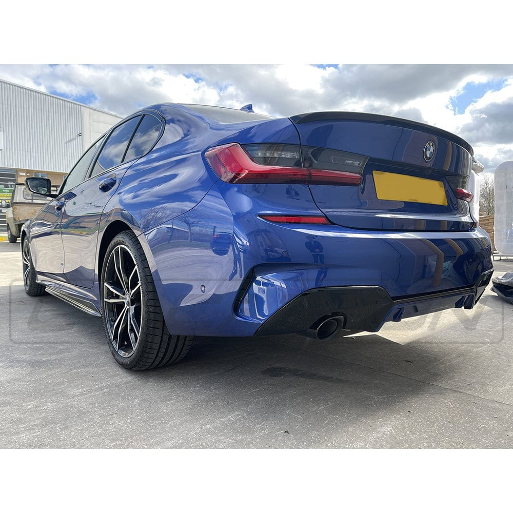 Black BMW 3 Series G20 M3 G80 gloss black spoiler by CT Carbon, featuring a sleek, aerodynamic MP style design on a car.