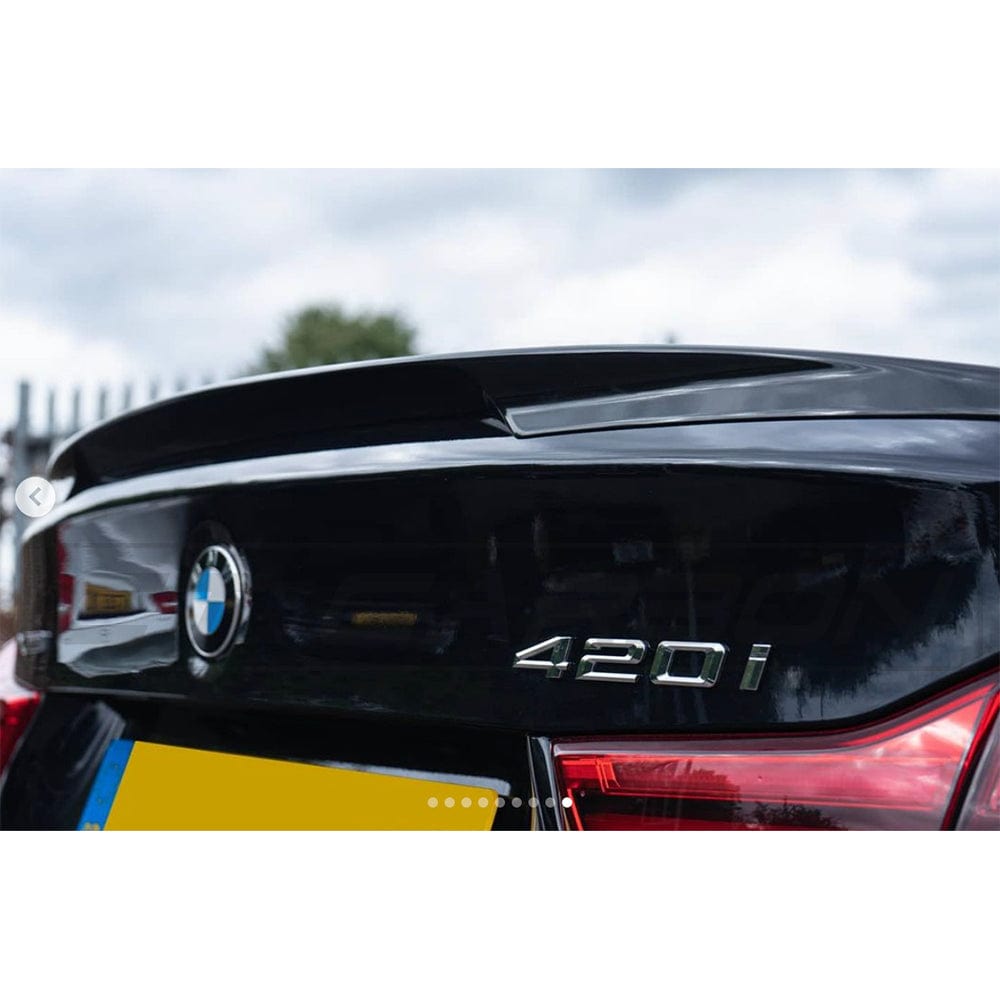 BMW 4 Series F36 gloss black spoiler by CT Carbon, lightweight MP style spoiler for sporty look and enhanced aerodynamics.