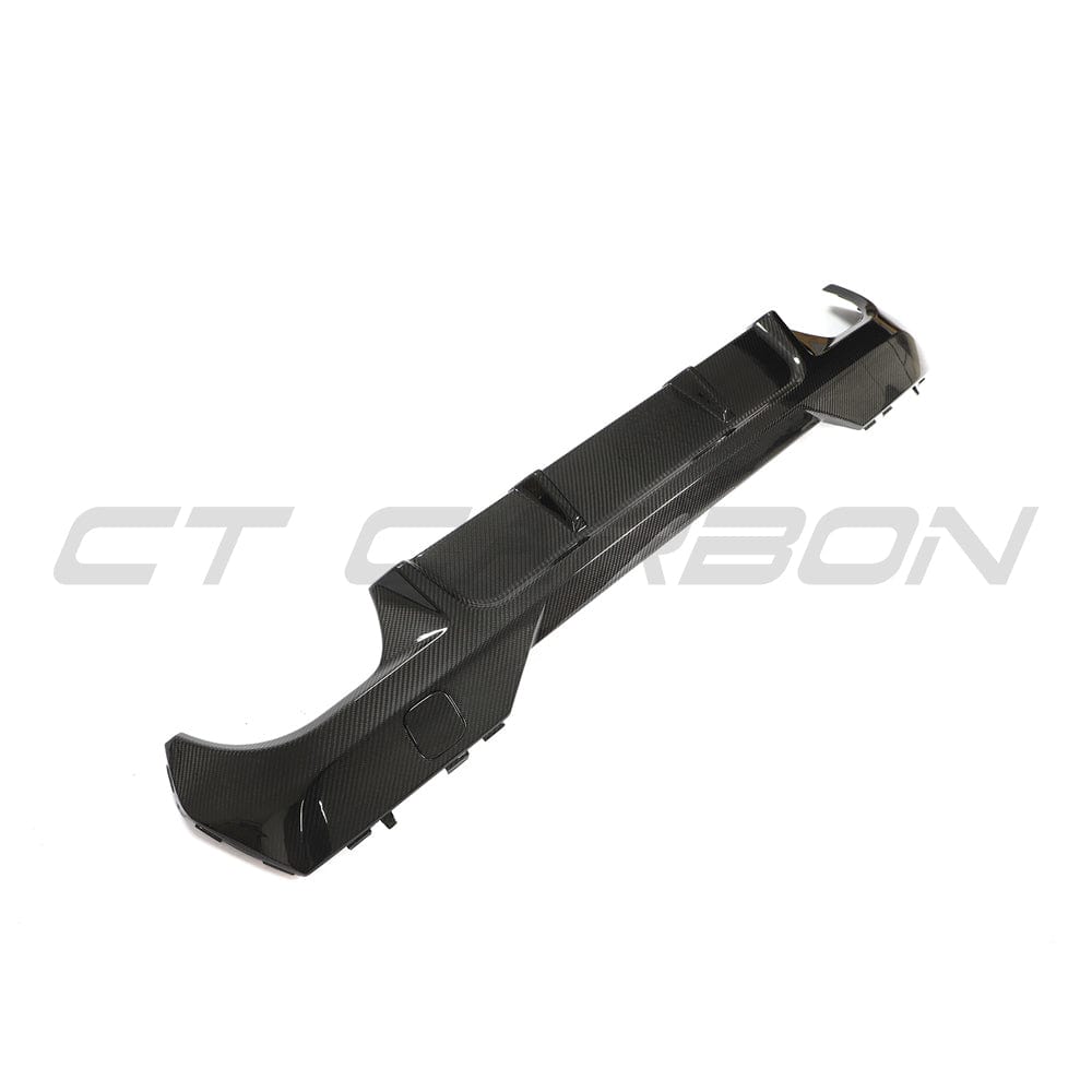 Black BMW G22 4 Series carbon fibre diffuser kit by CT Carbon, featuring sleek, lightweight carbon fibre components for enhanced sporty look.
