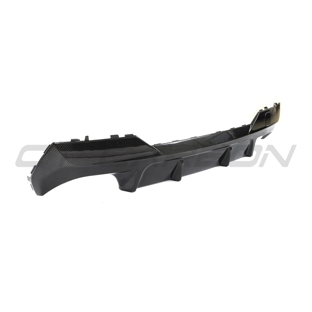 Black carbon fiber diffuser kit for BMW G22 4 Series by CT Carbon, showcasing sleek design and high-quality material.