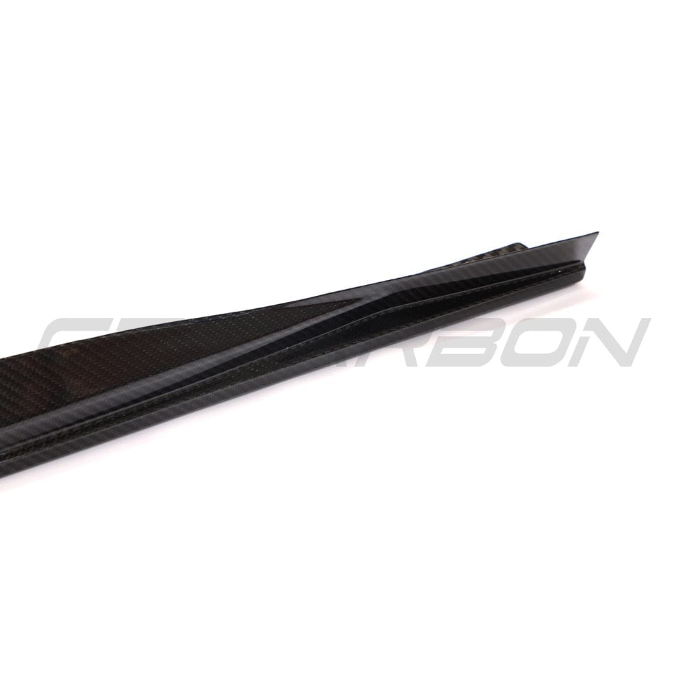 BMW 4 Series G22/G23 carbon fibre side skirts by CT Carbon, featuring sleek black design and aerodynamic styling.