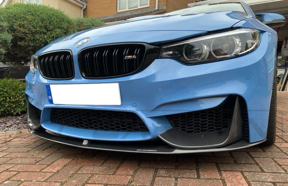 BMW M3 F80 double slat black grille by CT Carbon, showcasing sleek black carbon fiber design for enhanced sporty look.
