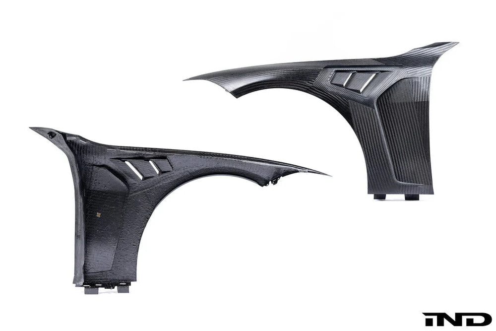 AlphaN carbon fiber front fender wings for BMW M3 G80 and M4 G82, lightweight aerodynamic fenders with a sleek finish.