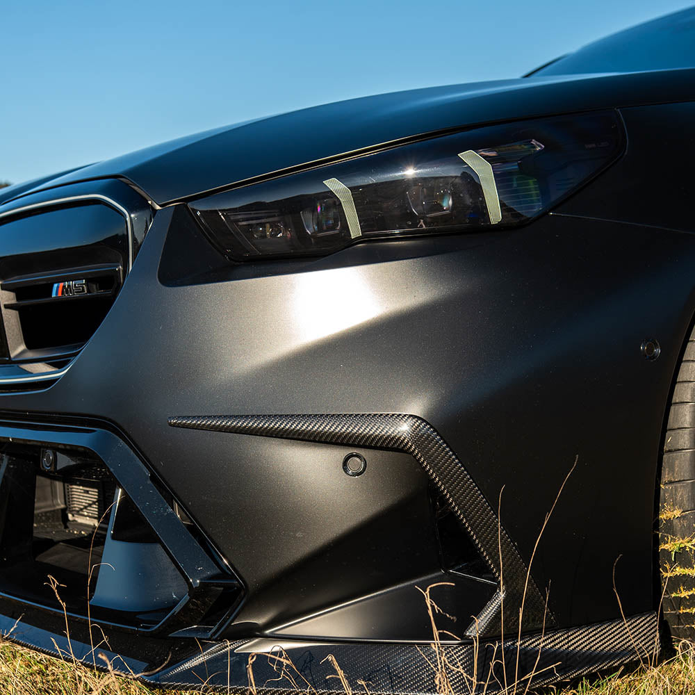 BMW G90 G99 M5 Carbon Fibre Front Bumper Trim by CT Carbon, showcasing sleek, lightweight accessory for sporty appearance.