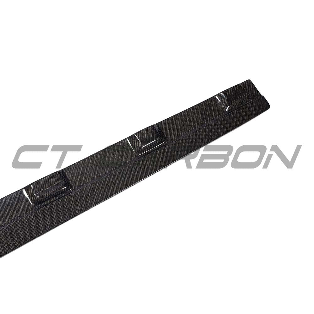 Audi A3 8V facelift carbon fibre side skirts by CT Carbon, showing sleek, textured side skirts on the car's body.