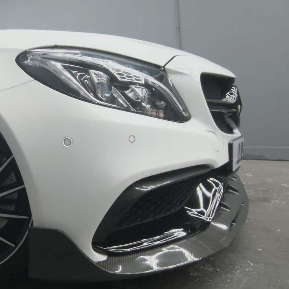 Mercedes C63/C63S W205 coupe and saloon carbon fiber bumper trim by CT Carbon, close-up of exterior styling accessory.