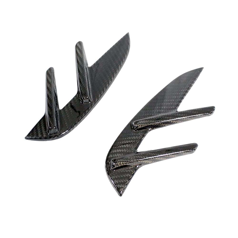 BMW M4 G82 G83 carbon fibre side fender trim by CT Carbon, close-up of sleek, lightweight automotive accessory on vehicle fender.